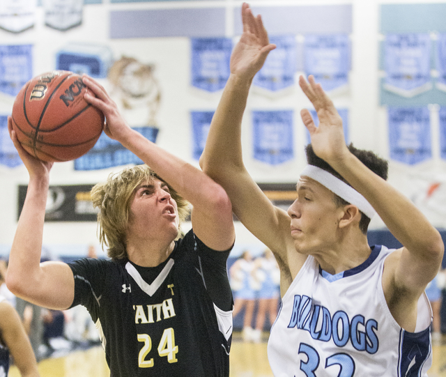 Faith Lutheran’s Nic Maccioni (24) takes a contested jump shot over Centennial’s ...