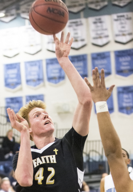 Faith Lutheran’s Elijah Kothe (42) shoots a jump shot over Centennial’s Alijah H ...