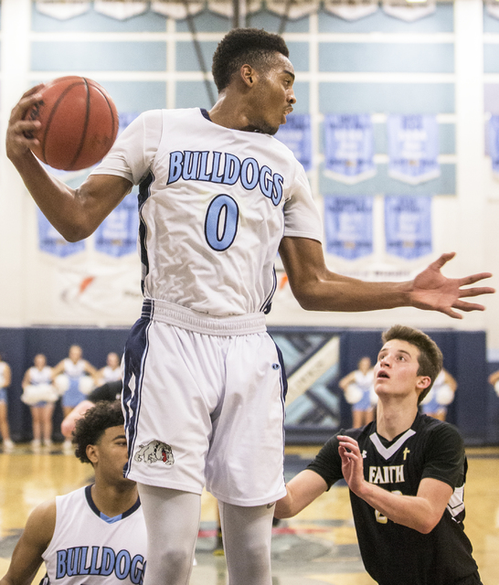 Centennial’s Troy Brown (0) grabs a rebound over Faith Lutheran’s Connor Nichols ...