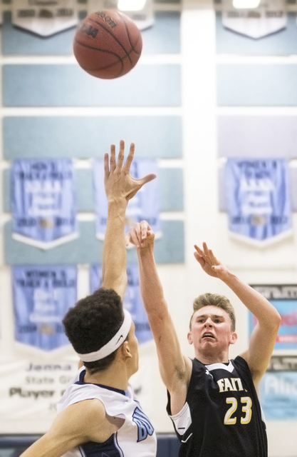 Faith Lutheran’s Brevin Walter (23) shoots a three over Centennial’s Darian Scot ...