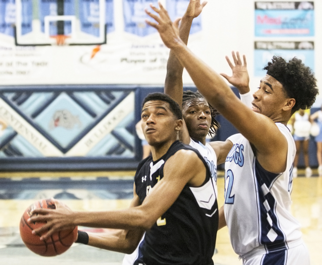 Faith Lutheran’s Jaylen Fox (2) slices to the rim past Centennial’s Alijah Hende ...