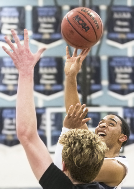 Centennial’s Ishon Hardin (24) shoots a contested jump shot over Faith Lutheran’ ...