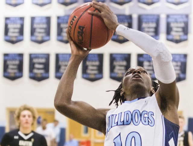 Centennial’s Isaiah Banks (10) converts a fast break layup during the Bulldog’s ...