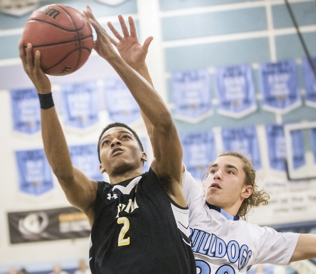 Faith Lutheran’s Jaylen Fox (2) slices to the rim past Centennial’s Steve Giles ...