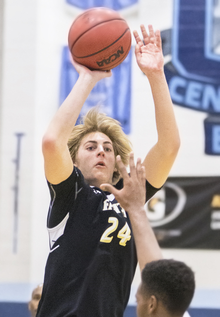 Faith Lutheran’s Nic Maccioni (24) shoots a three over Centennial’s Troy Brown ( ...