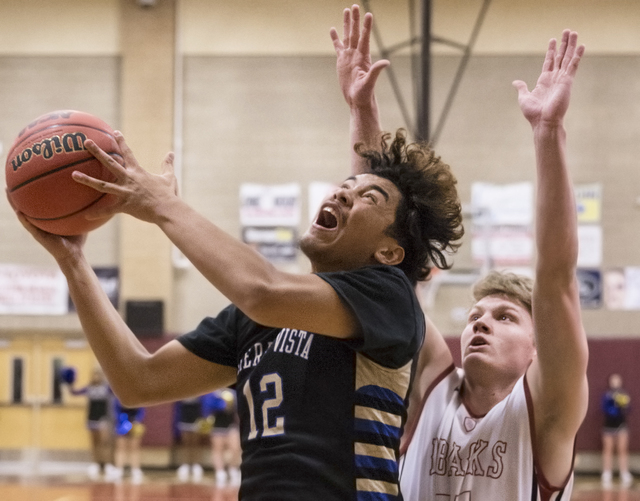 Sierra Vista’s Maui Sera Josef (12) drives past Desert Oasis’ Jacob Heese (15) o ...