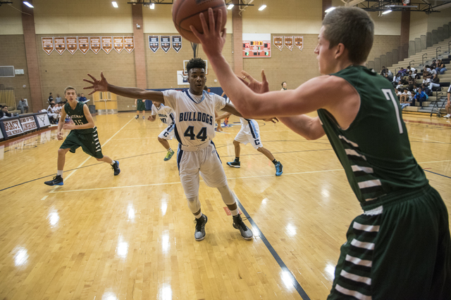 Matt Keis (7) of Robert Bateman High School of Canada passes the ball against Centennial&#82 ...