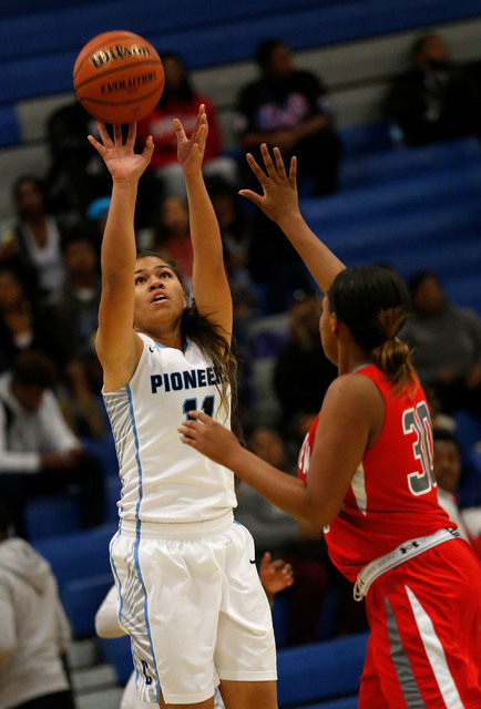 Canyon Springs’ Jeanette Fine, left, shoots over Arbor View’s Autumn Westmorelan ...