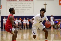 Gorman Bishop’s guard Christian Popoola (21) goes to pass Coronado’s guard Nick ...