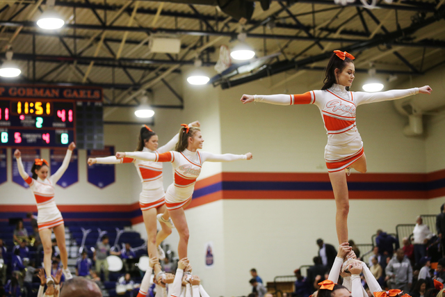 Bishop Gorman cheerleaders perform during the halftime of a basketball game between Bishop G ...