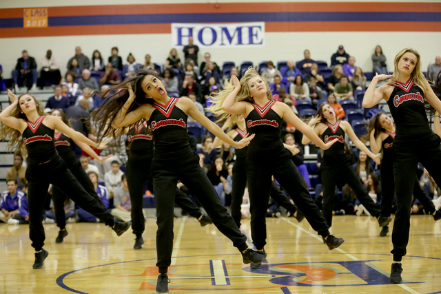 Coronado cheerleaders perform during the halftime of a basketball game between Bishop Gorman ...