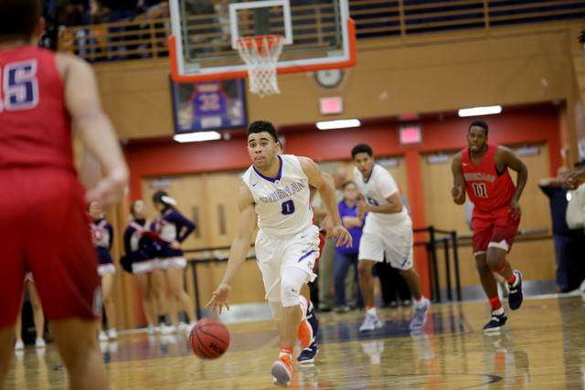 Bishop Gorman’s point guard Jarrett Jordan (0) dribbles the ball during a basketball g ...