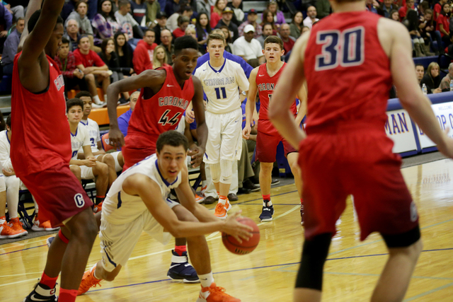 Bishops Gorman’s point guard Chance Michels (11) watches teammate forward Saxton Howar ...