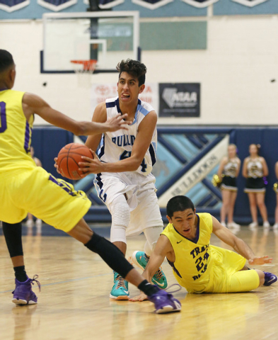 Centennial’s Kamakana Winquist, center, gains posession of a loose ball past by Durango&#8 ...