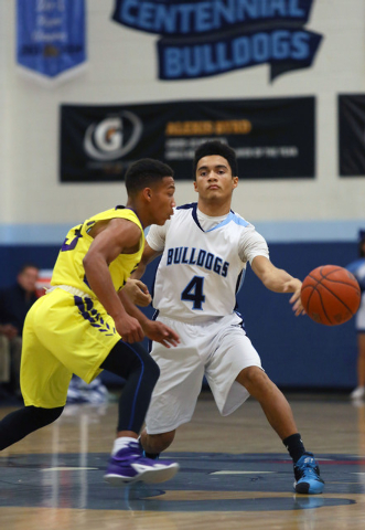 Centennial’s Terrance Traylor, right, passes the ball around Durango’s Demetrius Val ...