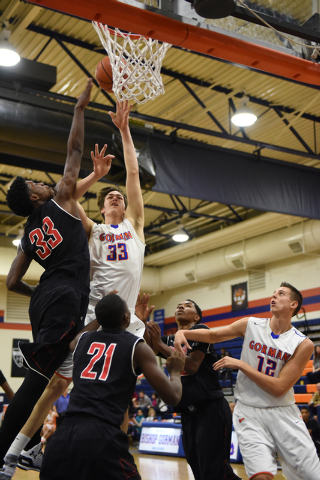 Bishop Gorman’s Stephen Zimmerman (33) shoots the ball overCorona Centennial’s J ...