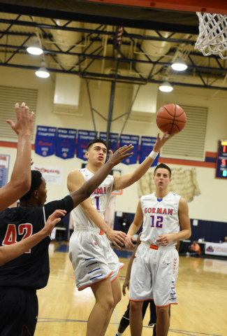 Bishop Gorman’s Chase Noma’aea (1) shoots the ball over Corona Centennial defend ...