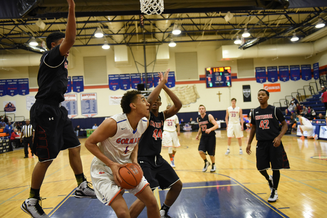 Bishop Gorman’s Chase Jeter (4) shoots the ball over Corona Centennial’s Ike Ani ...