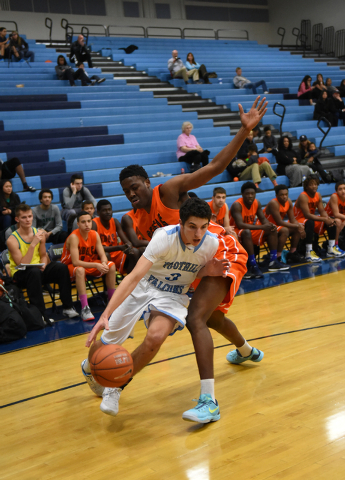 Foothill’s Colin Curi (3) dribbles past National Prep Academy’s Osa Wilson (21) ...