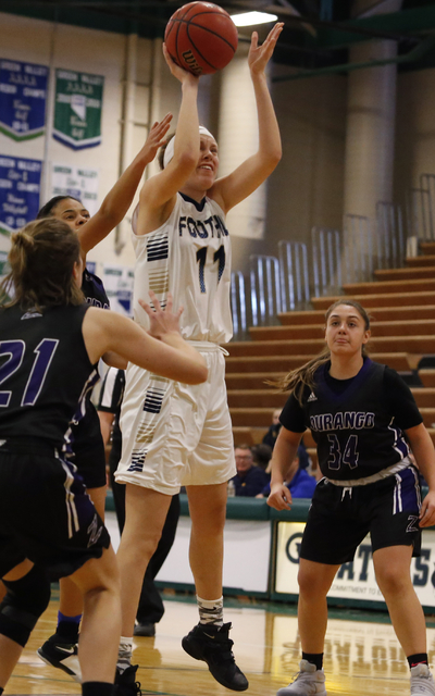 Foothill’s Kylie Vent (11) shoots a shot as Durango’s Lindiana Boku (34) and Rhi ...