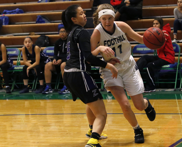 Foothill’s Kylie Vent (11) drives towards the hoop against Durango’s Dianne Lu ( ...