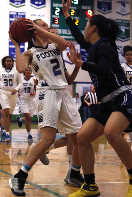 Foothill’s Aqui Williams attempts a shot against Durango’s Dianne Lu (15) during ...