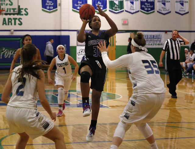 Durango’s Dar’Juanah Harris shoots a shot over Foothill’s Holly Wood (35) ...