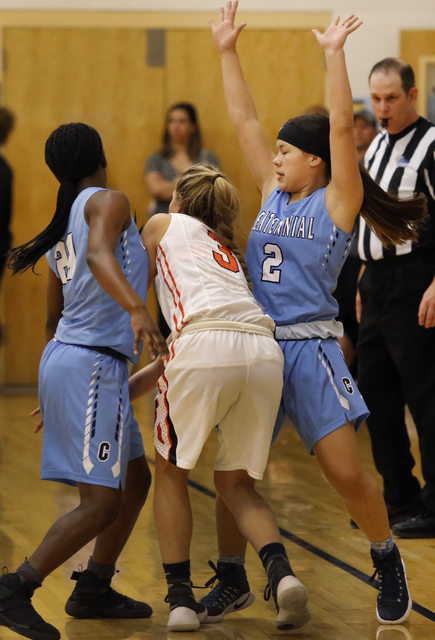 Centennial’s Melanie Isbell (2) and Centennial’s Scotteanna Thomas (20) double ...