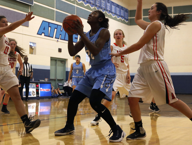 Centennial’s Eboni Walker (22) shoots during a high school basketball game at the Las ...