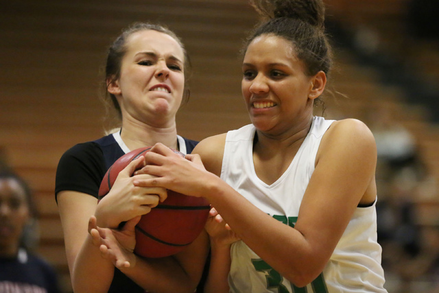 Coronado sophomore Tegan Varrati (43), left, and Green Valley junior Samar Miller (30), righ ...