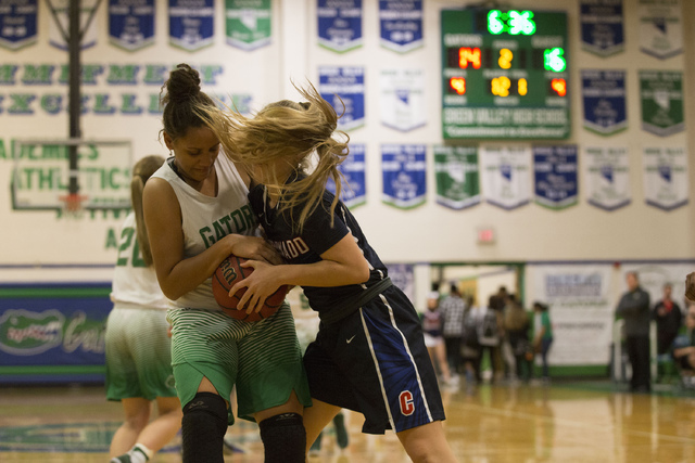 Green Valley junior Samar Miller (30), left, and Coronado junior Lexie Engdahl (31), right, ...