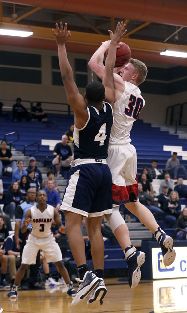 Coronado’s Kennedy Koehler (30) shoots over Foothill’s Mauricio Smith (4) during ...