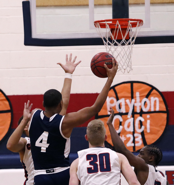 Foothill’s Mauricio Smith (4) shoots during the first half of a high school basketball ...