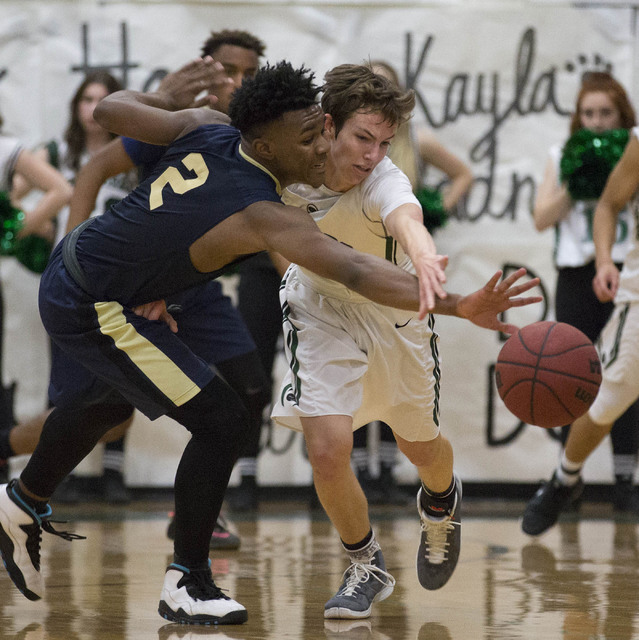 Palo Verde junior Mitchell Olsen, right, and Shadow Ridge senior James Fuller, left, battle ...