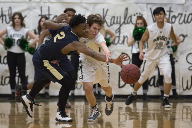 Palo Verde junior Mitchell Olsen, right, and Shadow Ridge senior James Fuller, left, battle ...