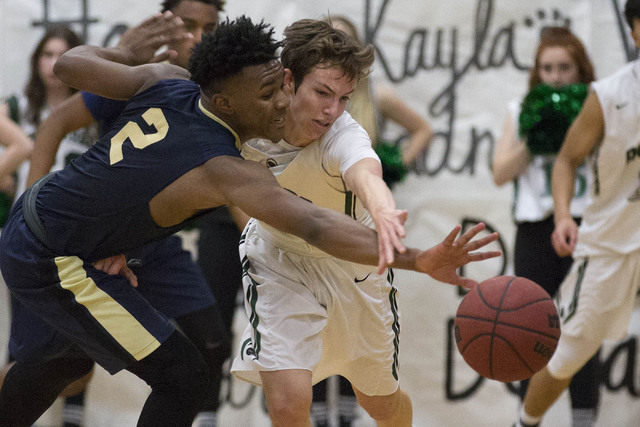 Palo Verde junior Mitchell Olsen, right, and Shadow Ridge senior James Fuller, left, battle ...