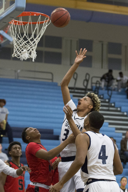 Foothill senior Carl Fischer attempts a shot but it bounces off the rim at Foothill High Sch ...