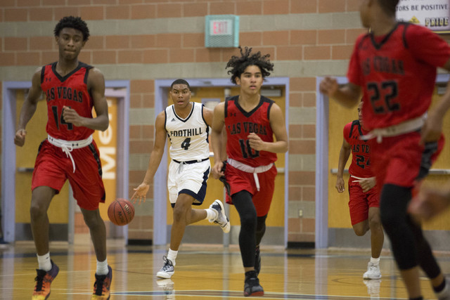 Foothill senior Mauricio Smith brings the ball up the court at Foothill High School on Tuesd ...