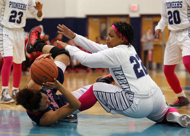 Liberty’s Aubre Fortner, left, and Canyon Springs’ Skyler Franklin get tangled d ...