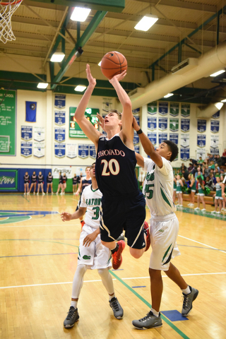 Coronado’s Nick Kornieck (20) shoots the ball against Green Valley’s Kelvin Omoj ...