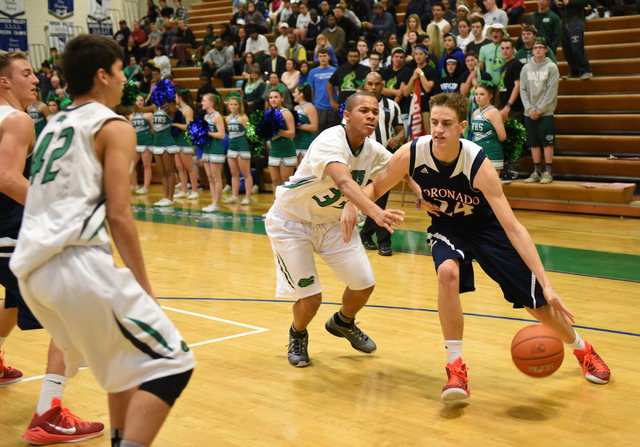 Coronado’s Jake DesJardins (24) drives past Green Valley’s Myles Dunn (33) on We ...