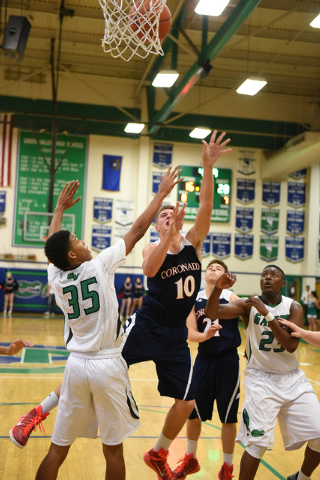 Coronado’s Travis Boman (10) shoots the ball over Green Valley’s Isiah Macklin ( ...