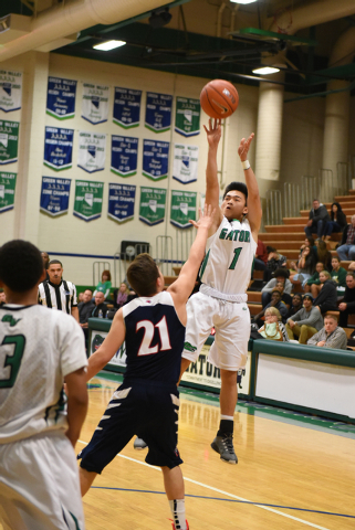 Green Valley’s Kris Nicholas (1) shoots the ball over Coronado’s Andrew Palma (2 ...