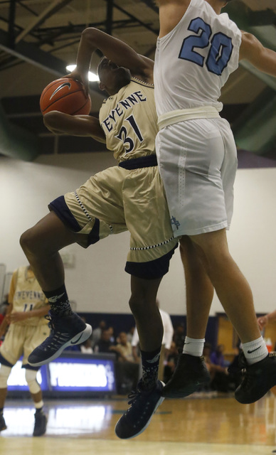 Cheyenne’s Hahsonie Laushaul (31) shoots againsts Canyon Spring’s Joseph Haulcy ...