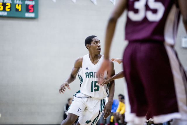 Rancho Rams Senior Justin Holiday (15), plays offense against Agassi Prep at Rancho High Sc ...