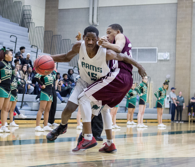 Rancho Rams Senior Justin Holiday (15), handles the ball against Agassi Prep at Rancho High ...