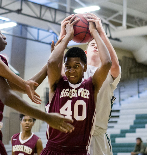 Agassi Prep Forward Miles Mixon (40), rebounds the ball against the Rancho Rams at Rancho Hi ...