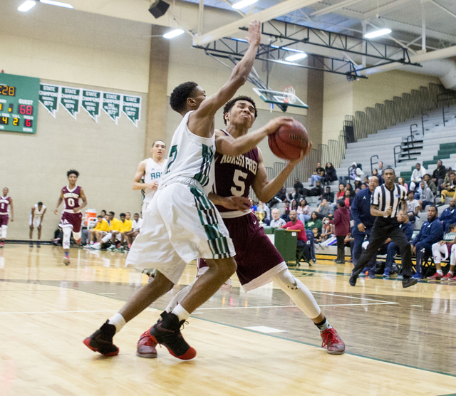 Agassi Prep Guard Allen Merritt, (5), handles the ball against the Rancho Rams at Rancho Hig ...