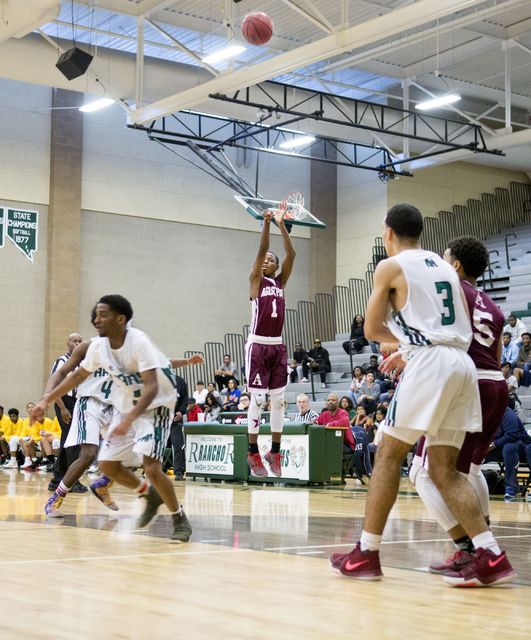 Agassi Prep Guard Najeeb Muhammad, (1), shoots the ball against the Rancho Rams at Rancho Hi ...