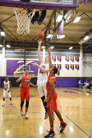 Legacy’s Brody Olenslager (55) goes up for a shot against La Salle’s Isiah Spenc ...